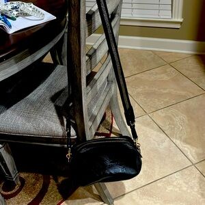 Black Coach crossbody with gold and silver